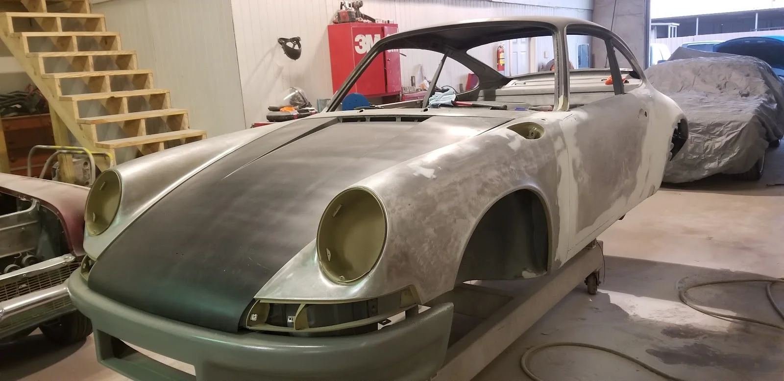 Bare-metal classic restoration in progress at 77 Hot Rods & Customs